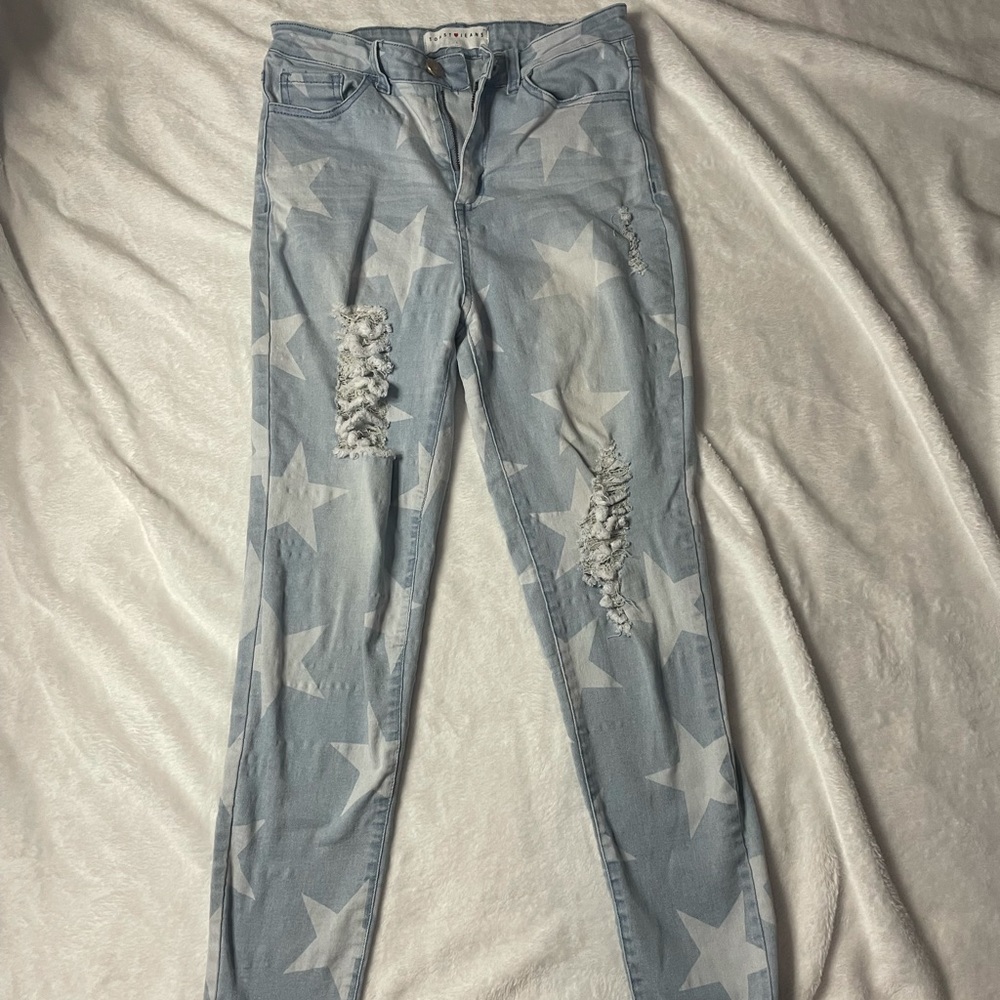 star patterned ripped jeans